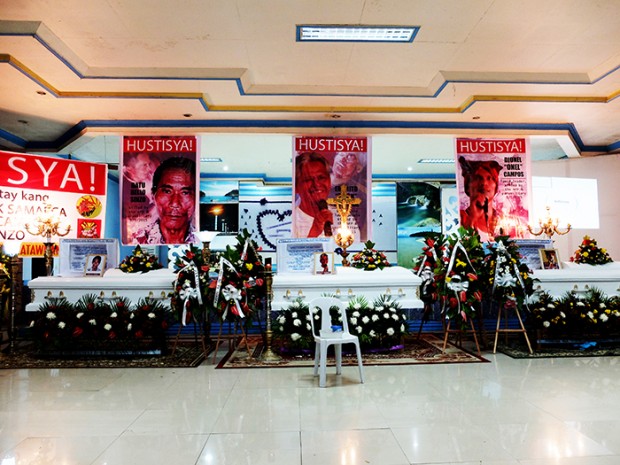 Unusual, yet regular, are the banners over coffins of extra-judicial killing victims in Mindanao, mostly lumads who defend their land from mining plunder, demanding justice.