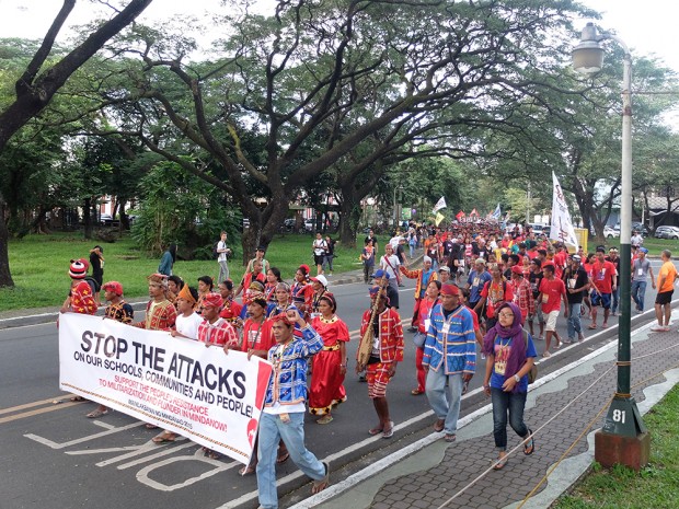Manilakbayan participants march from their campsite to the academic oval to meet supporters.