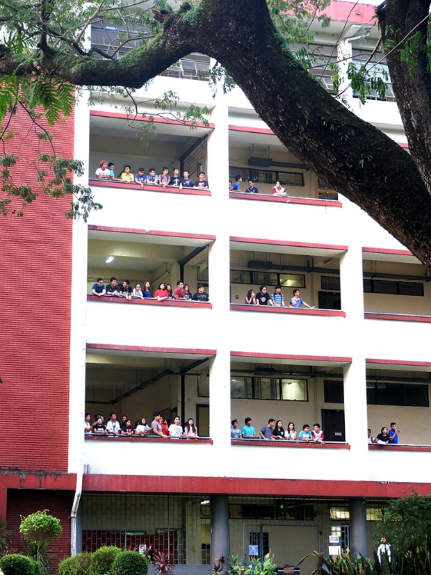College of Engineering students watching the unity walk from the Melchor Hall.