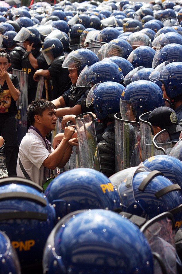 A youth activist tries to make the police understand why they should oppose the APEC as well.