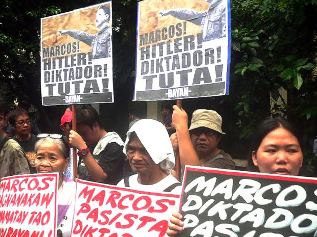 Rally at the Supreme Court protesting Marcos' burial at the LNMB revives old slogans against the former president.